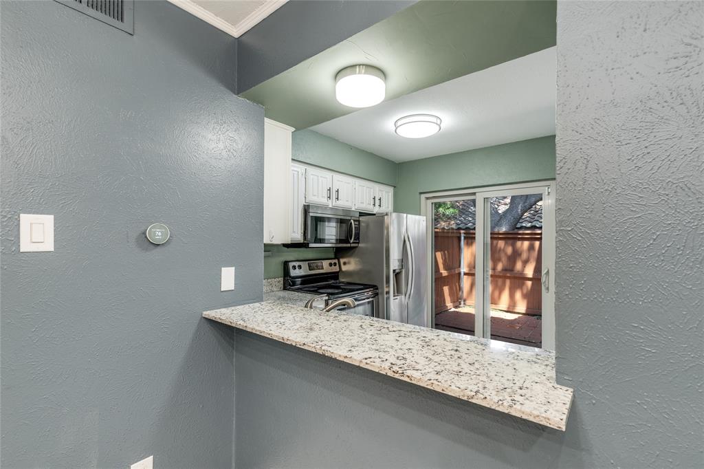 5626 Preston Oaks Road, Unit 42B Dallas, TX 75254 - Photo 12 of 25 a view of a workspace with furniture