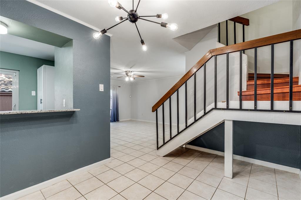 5626 Preston Oaks Road, Unit 42B Dallas, TX 75254 - Photo 14 of 25 a view of staircase with white walls and window