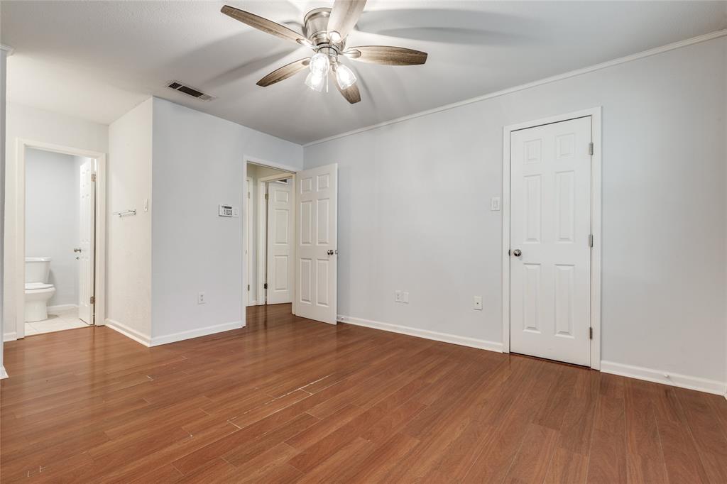 5626 Preston Oaks Road, Unit 42B Dallas, TX 75254 - Photo 17 of 25 a view of an empty room with wooden floor