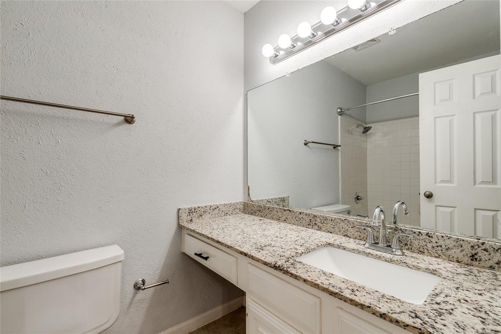5626 Preston Oaks Road, Unit 42B Dallas, TX 75254 - Photo 18 of 25 a bathroom with a granite countertop sink and a mirror