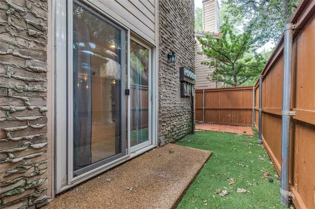 a view of a back yard from a balcony