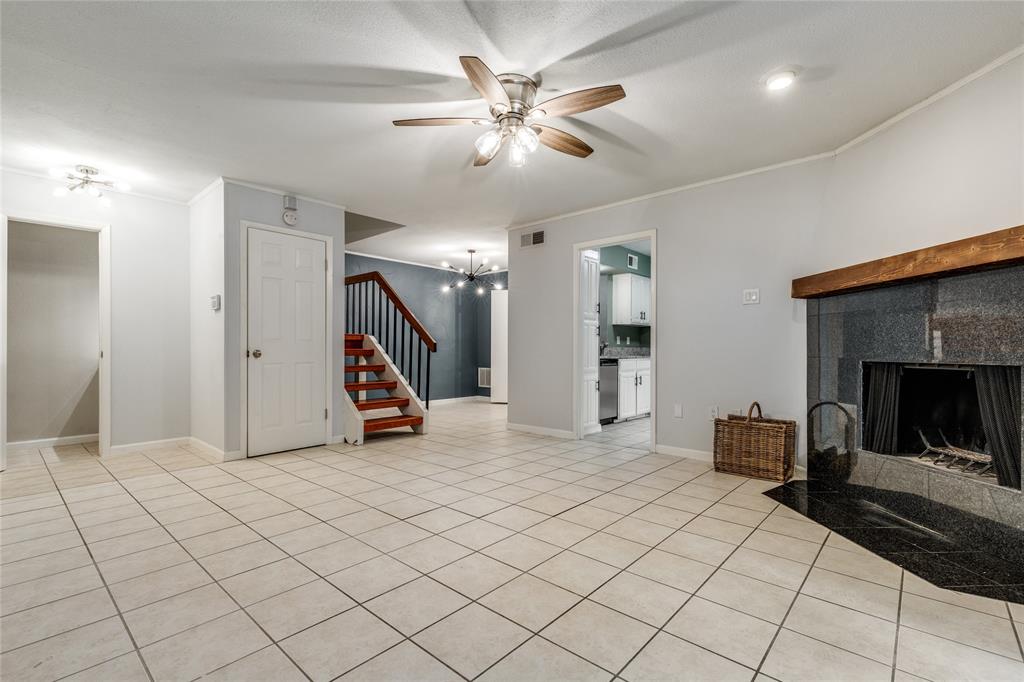 5626 Preston Oaks Road, Unit 42B Dallas, TX 75254 - Photo 8 of 25 a living room with furniture and a fireplace