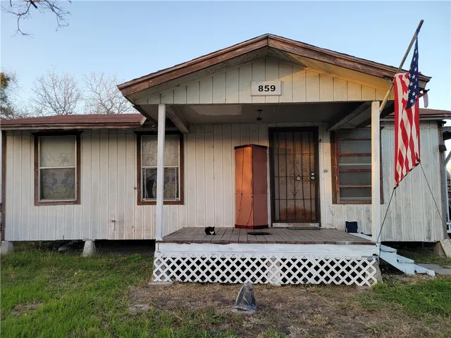 a front view of a house with a garage