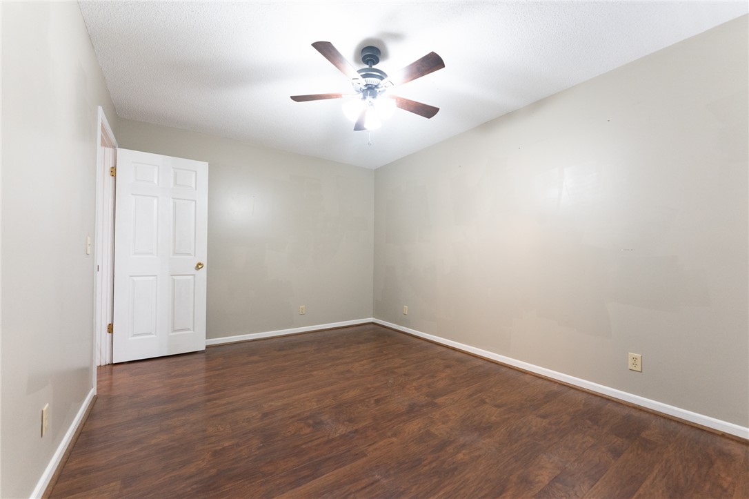 117 Shaftsbury Road Clemson, SC 29631 - Photo 13 of 29 Warm wood flooring grounds this versatile room featuring clean-lined walls and classic white trim.