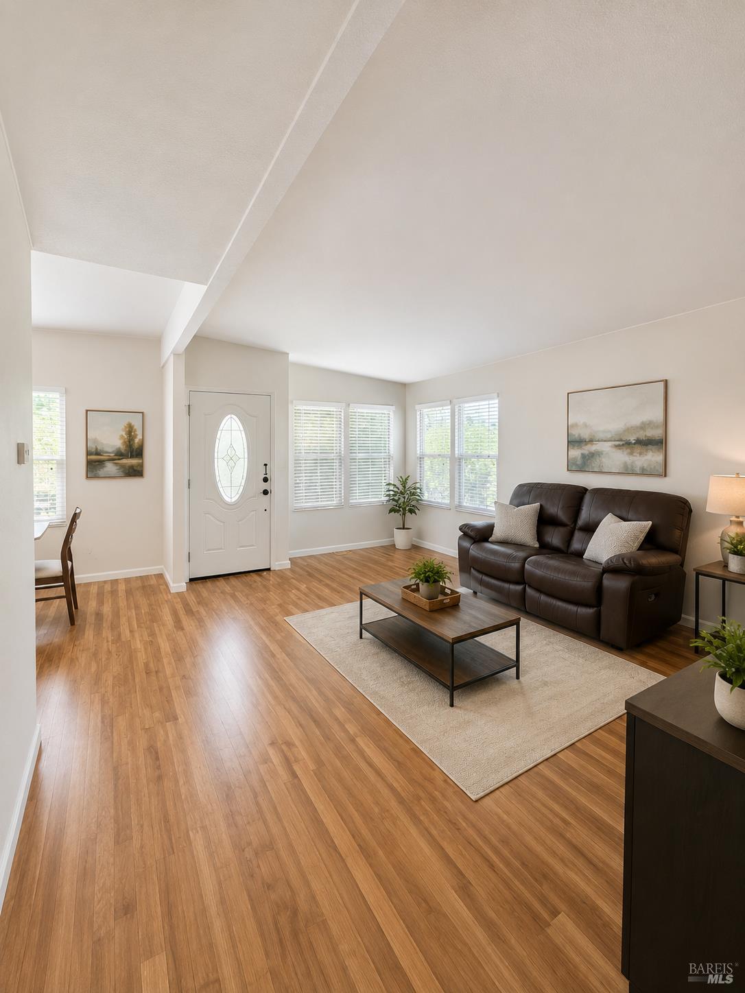 1945 Piner Road, Unit 16 Santa Rosa, CA 95403 - Photo 4 of 18 a living room with furniture and wooden floor