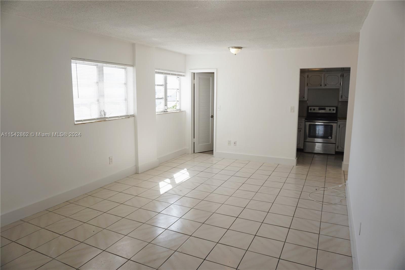 1340 Lincoln Road, Unit 608 Miami Beach, FL 33139 - Photo 4 of 10 a view of an empty room and window