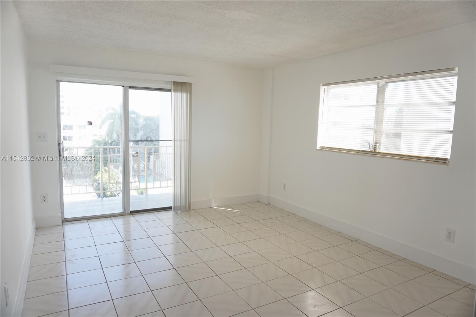 1340 Lincoln Road, Unit 608 Miami Beach, FL 33139 - Photo 6 of 10 a view of an empty room and window