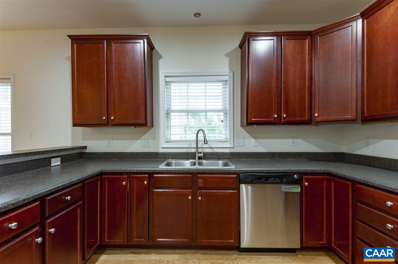 907 Raymond Road Charlottesville, VA 22902 - Photo 11 of 34 a kitchen with wooden cabinets