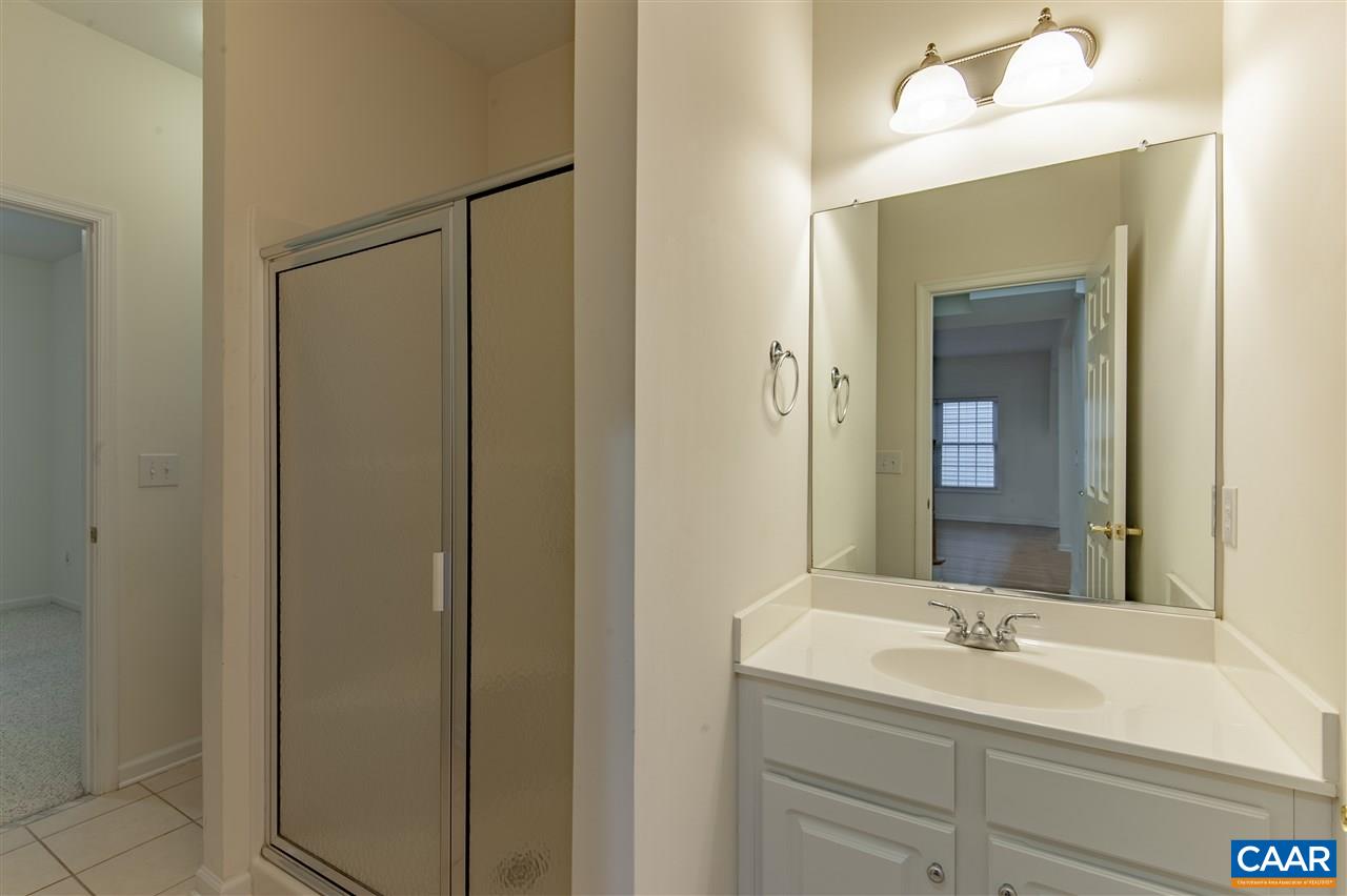 907 Raymond Road Charlottesville, VA 22902 - Photo 16 of 34 a bathroom with a sink and a mirror
