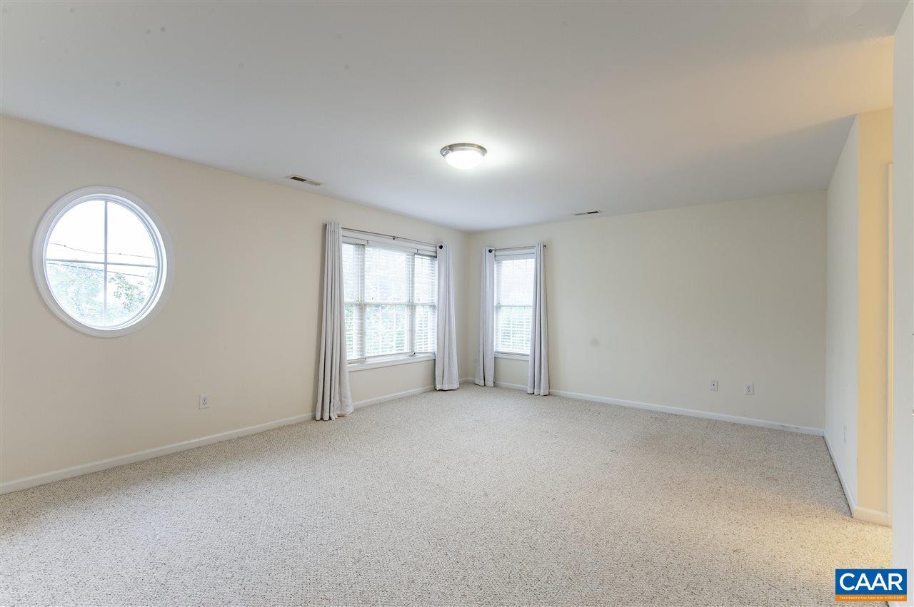 907 Raymond Road Charlottesville, VA 22902 - Photo 17 of 34 an empty room with a window and a mirror