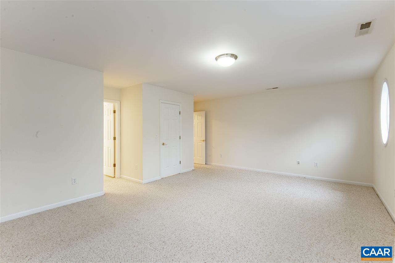 907 Raymond Road Charlottesville, VA 22902 - Photo 18 of 34 an empty room with a natural light
