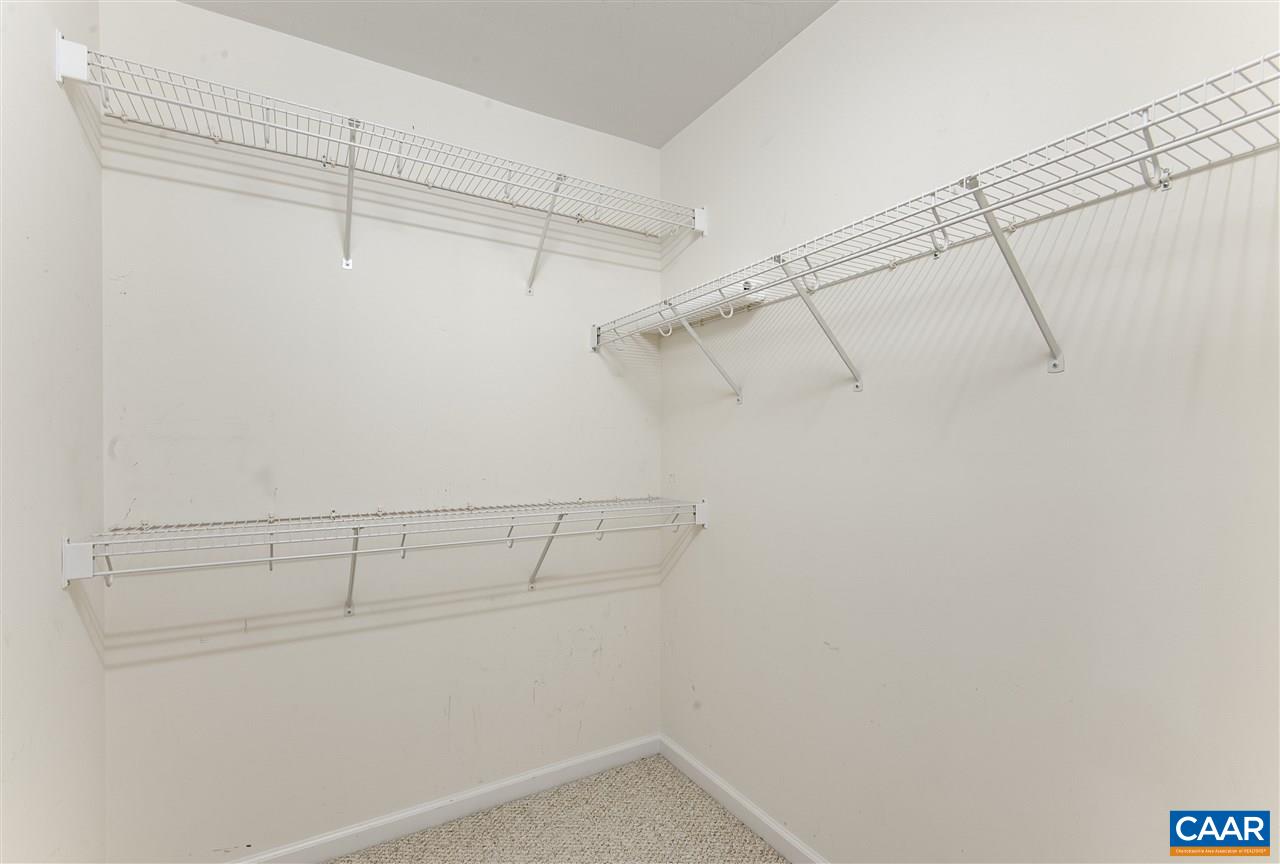 907 Raymond Road Charlottesville, VA 22902 - Photo 19 of 34 a view of a room with racks on the wall