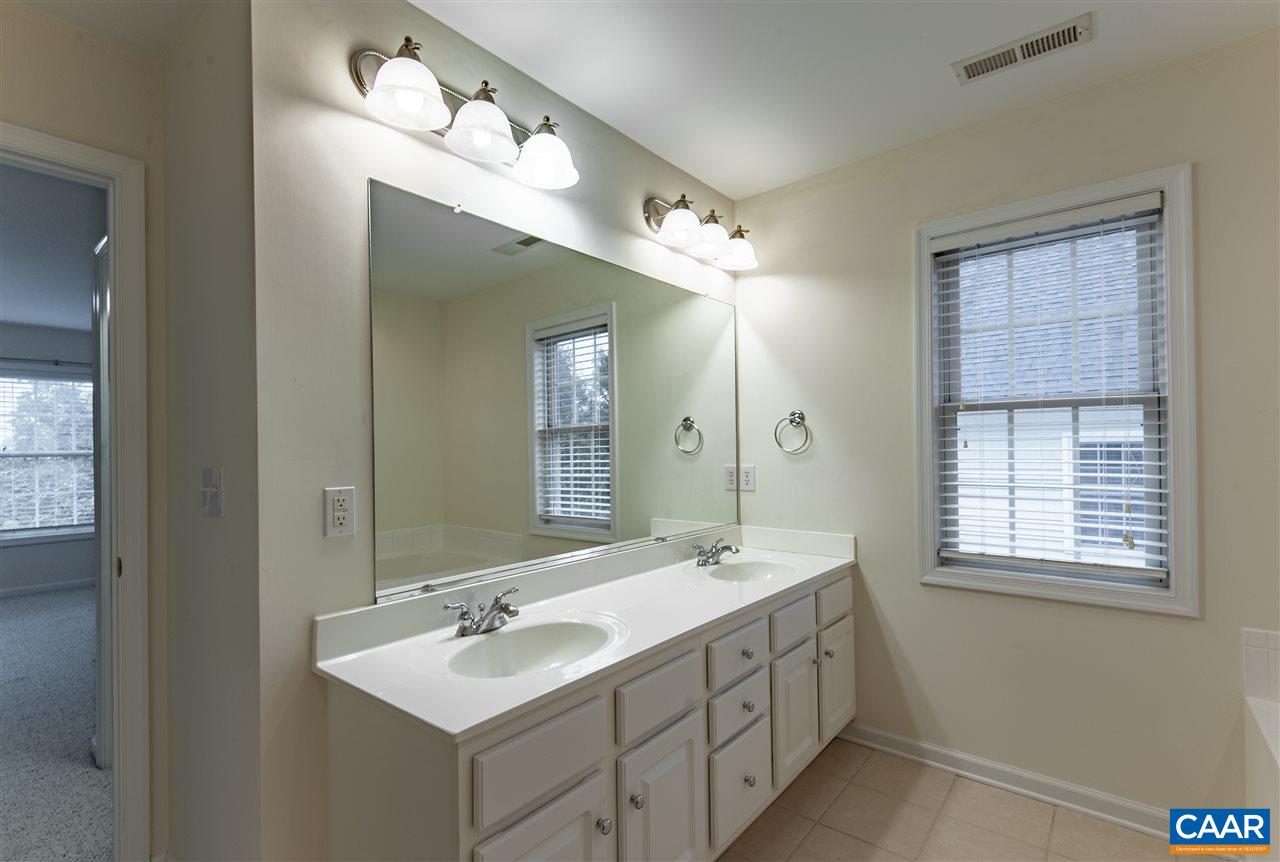 907 Raymond Road Charlottesville, VA 22902 - Photo 20 of 34 a bathroom with double sink and a mirror