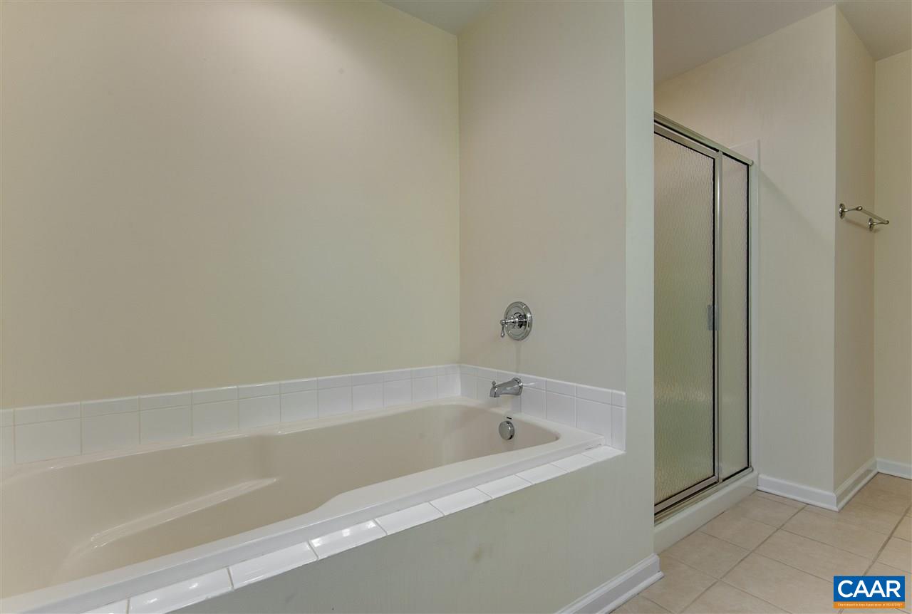 907 Raymond Road Charlottesville, VA 22902 - Photo 21 of 34 a white bath tub sitting next to a shower