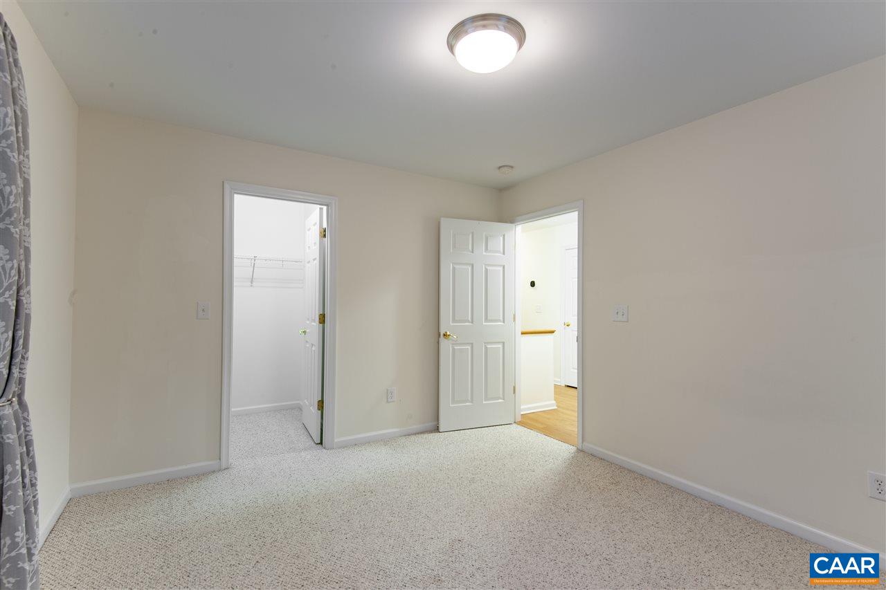 907 Raymond Road Charlottesville, VA 22902 - Photo 23 of 34 an empty room with a cabinet and a bathroom