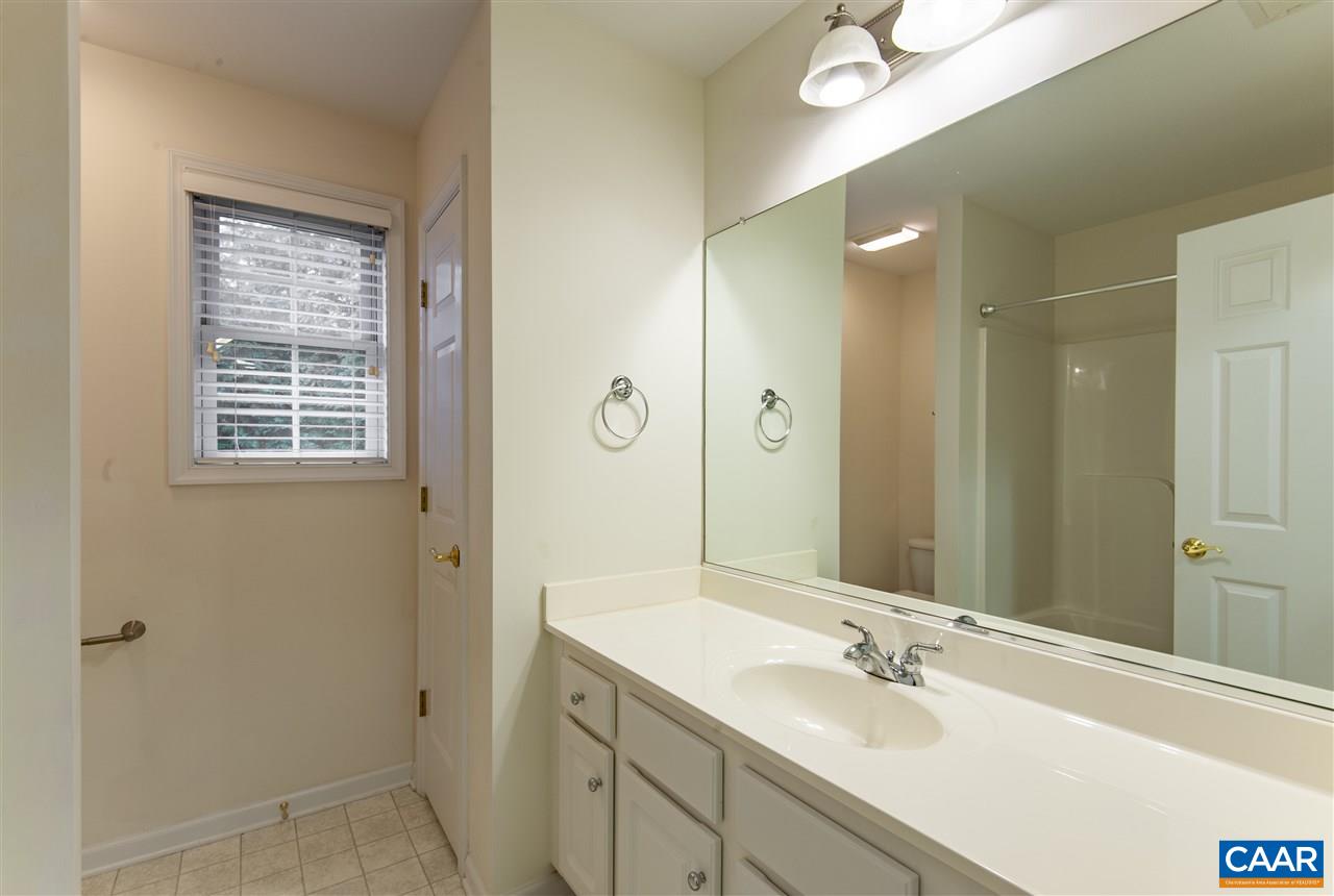 907 Raymond Road Charlottesville, VA 22902 - Photo 24 of 34 a bathroom with a sink double vanity granite tub and shower