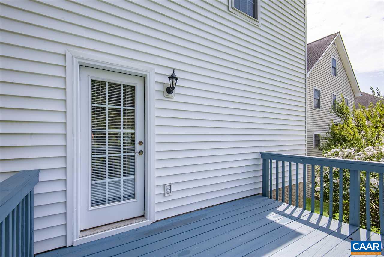 907 Raymond Road Charlottesville, VA 22902 - Photo 34 of 34 a view of a deck with wooden floor and a gate