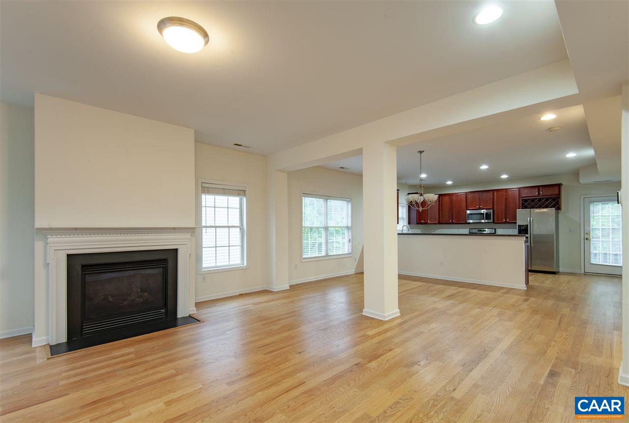 907 Raymond Road Charlottesville, VA 22902 - Photo 5 of 34 a view of a kitchen with a sink and a fireplace