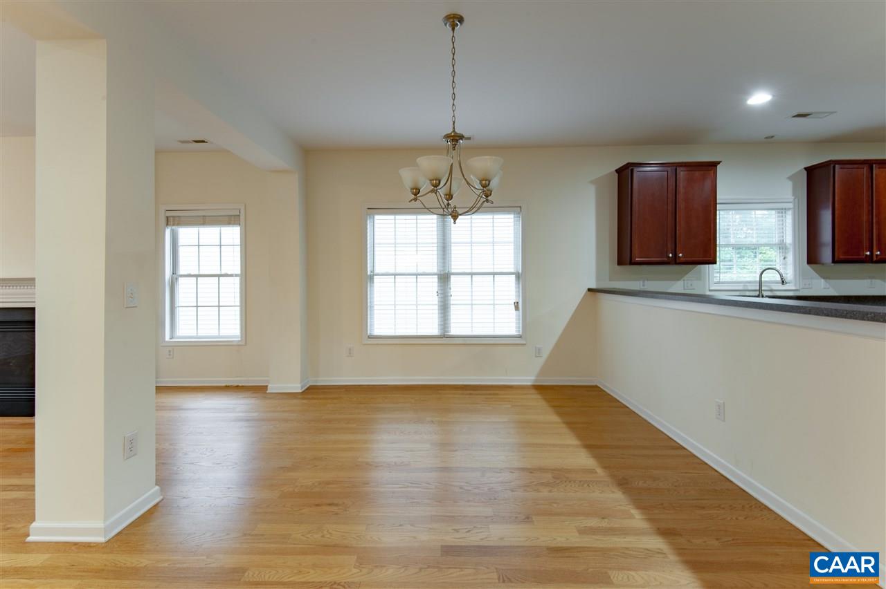 907 Raymond Road Charlottesville, VA 22902 - Photo 7 of 34 a view of empty room with wooden floor and fan