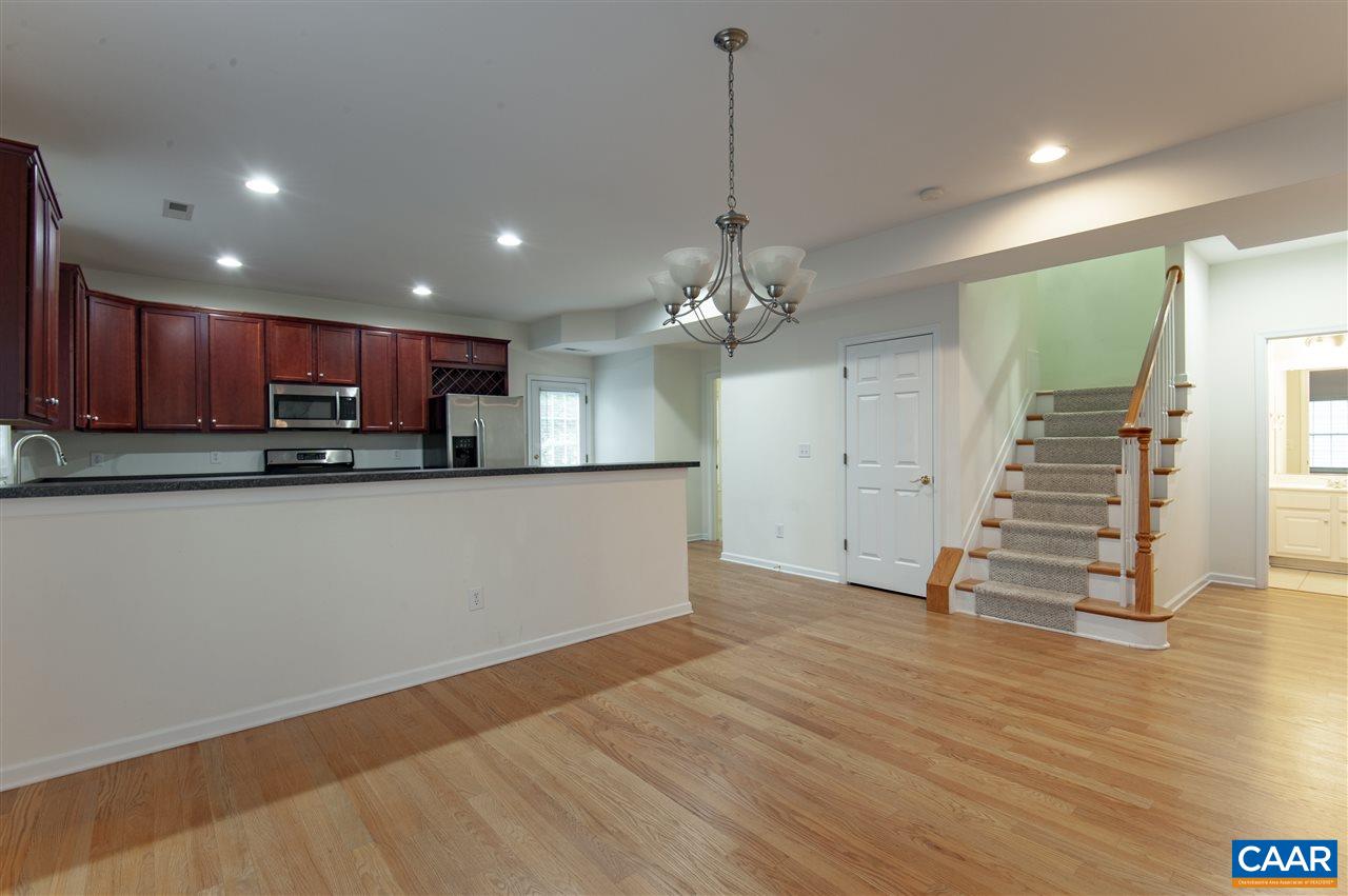 907 Raymond Road Charlottesville, VA 22902 - Photo 8 of 34 a view of a kitchen with wooden floor and a sink
