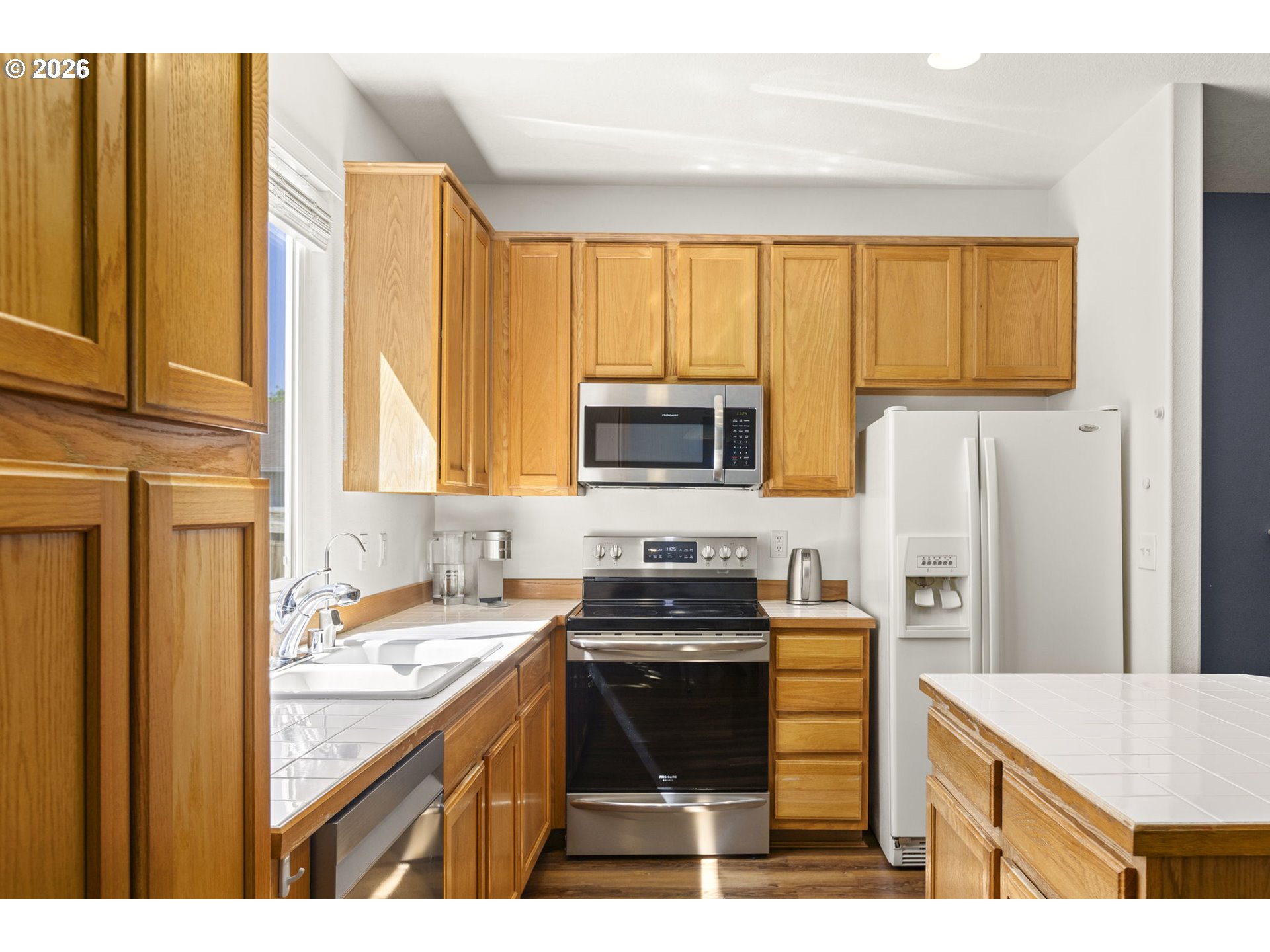 3418 Northwest 30th Circle Camas, WA 98607 - Photo 10 of 43 a kitchen with a sink stove top oven and refrigerator
