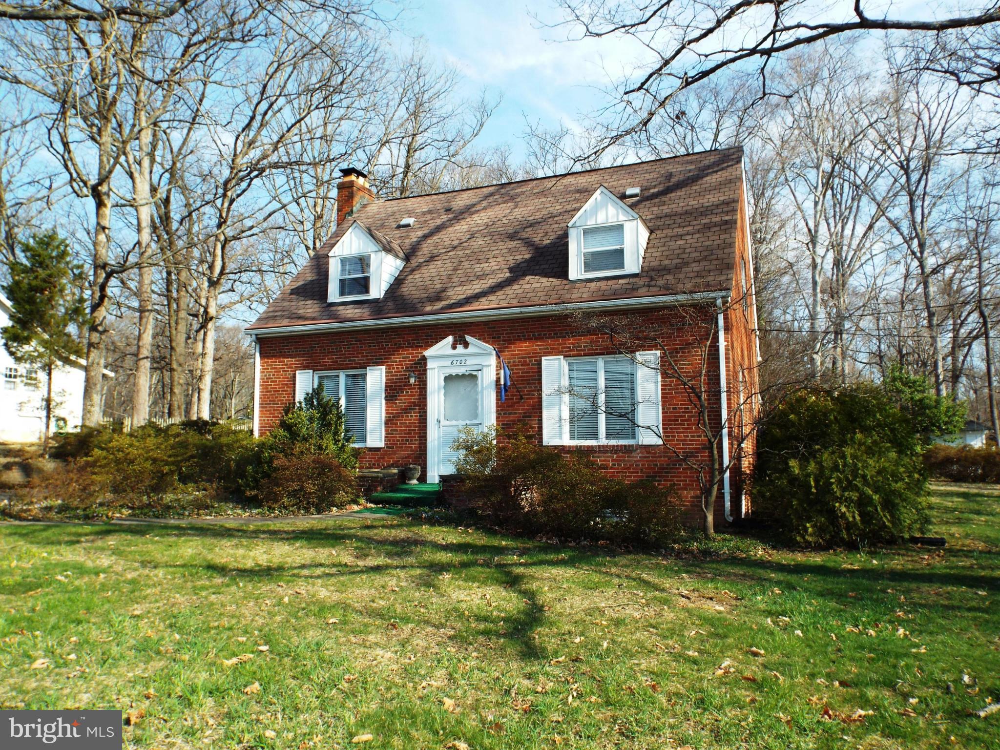 6702 Braddock Road Annandale, VA 22003 - Photo 1 of 10 a front view of house with yard and green space