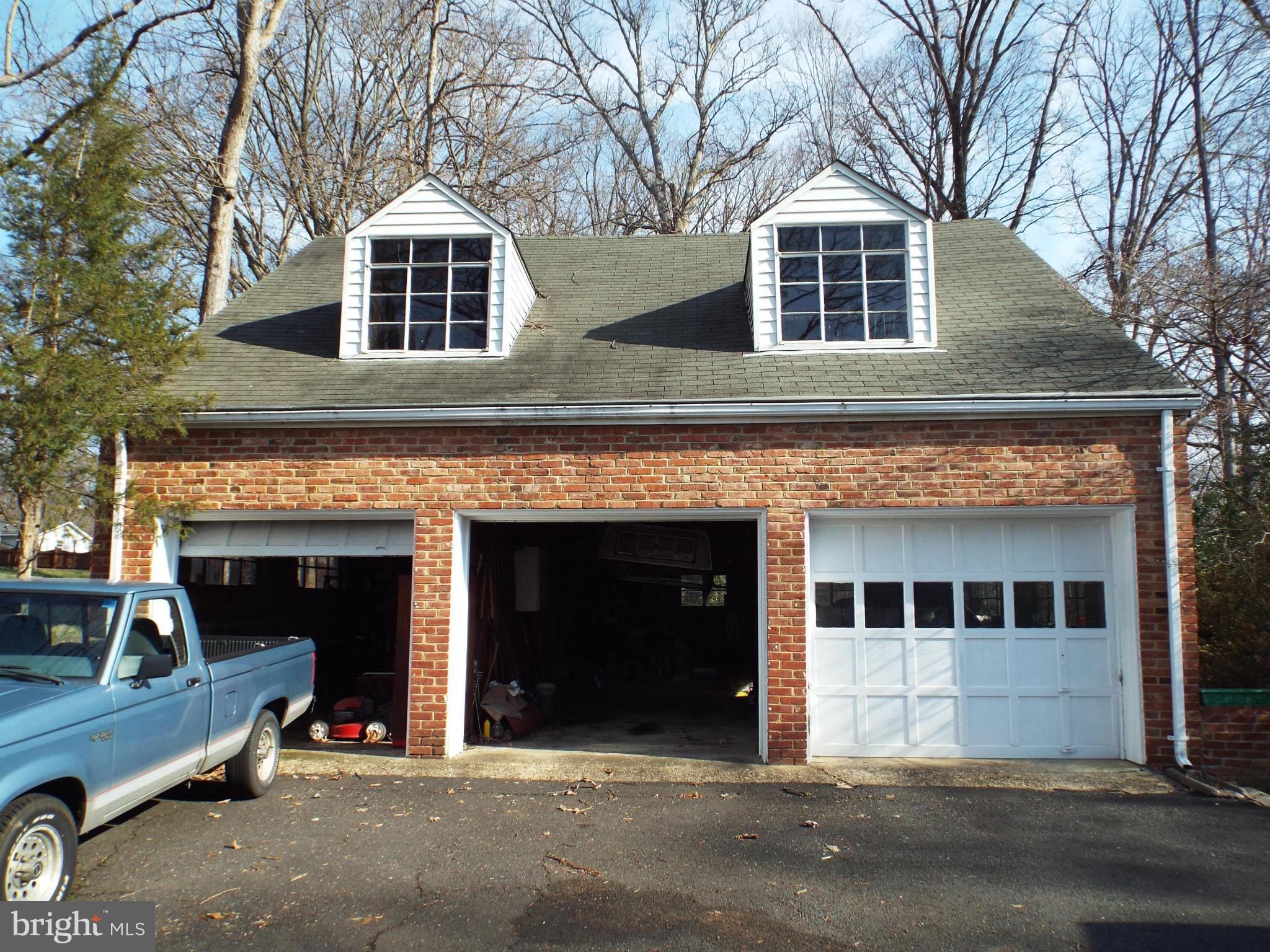 6702 Braddock Road Annandale, VA 22003 - Photo 4 of 10 a front view of a house with yard
