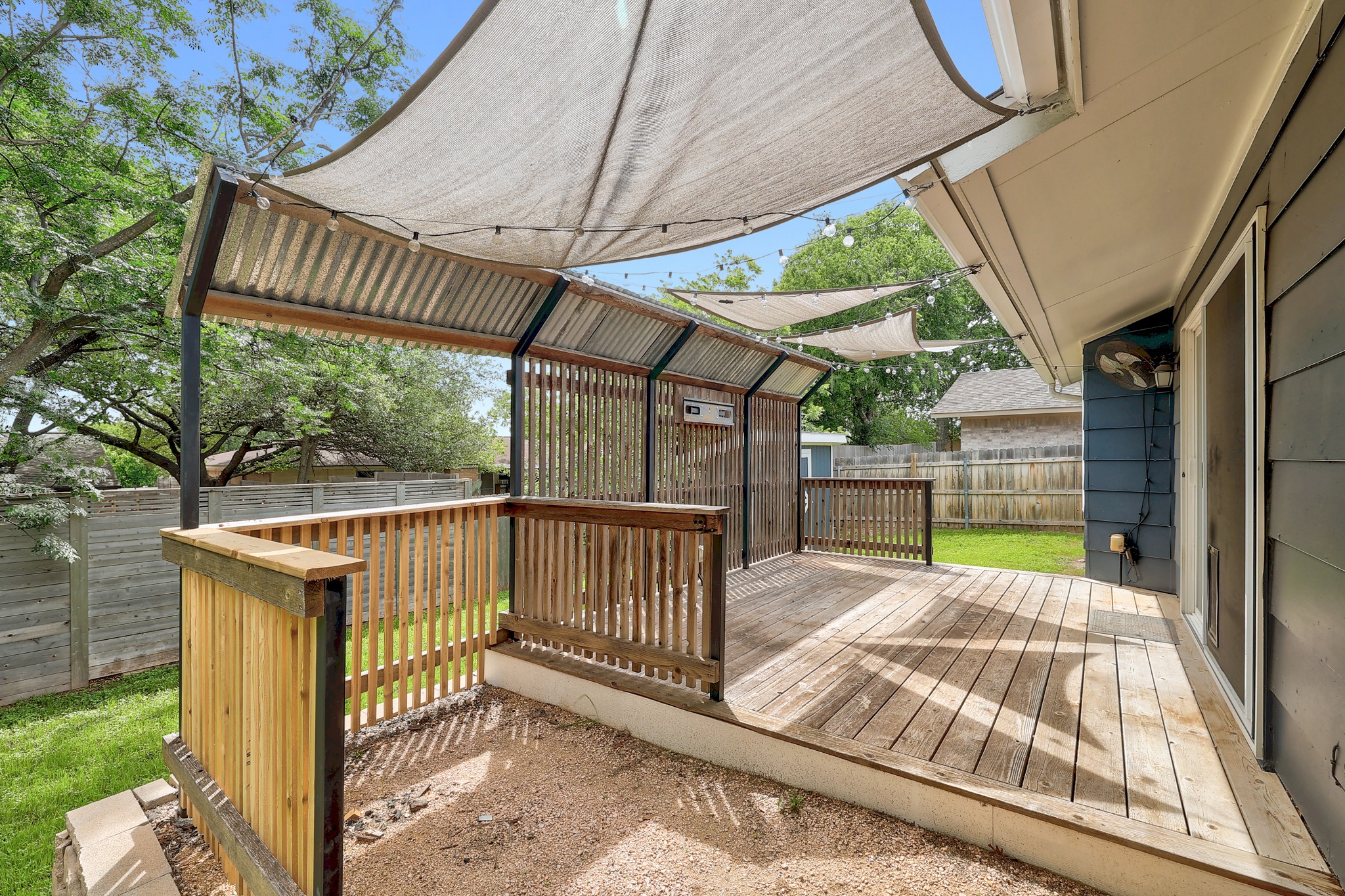 9614 Chukar Circle Austin, TX 78758 - Photo 4 of 26 The deck was added in 2021 providing you with an elevated outdoor living space overlooking spacious yards on both sides.