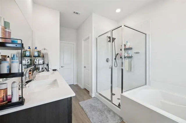 a bathroom with a tub and a sink
