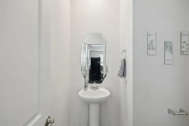 a bathroom with a sink and mirror