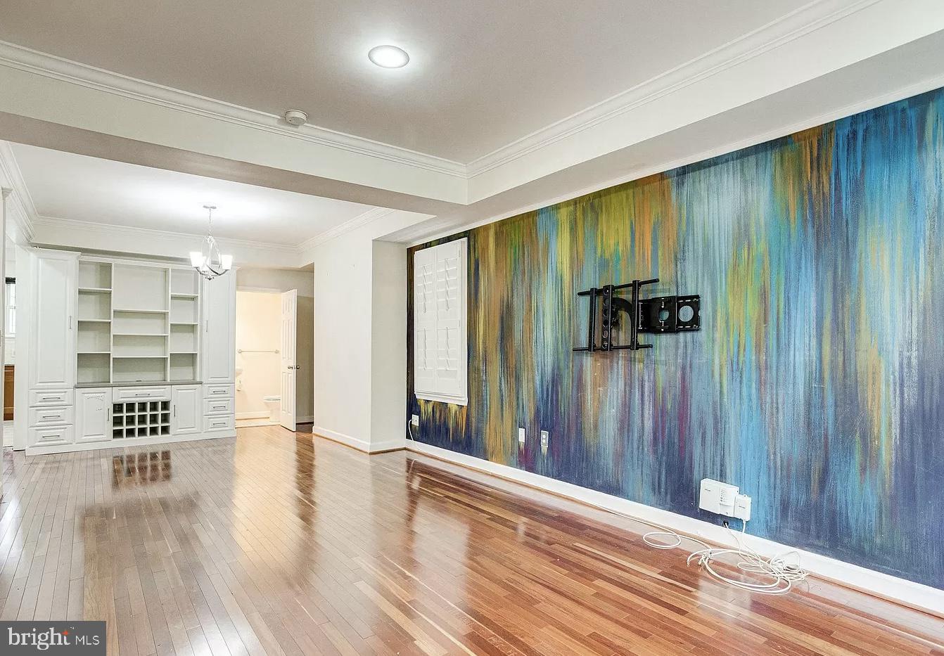 595 Columbia Road Northwest Washington, DC 20001 - Photo 3 of 36 wooden floor in an empty room