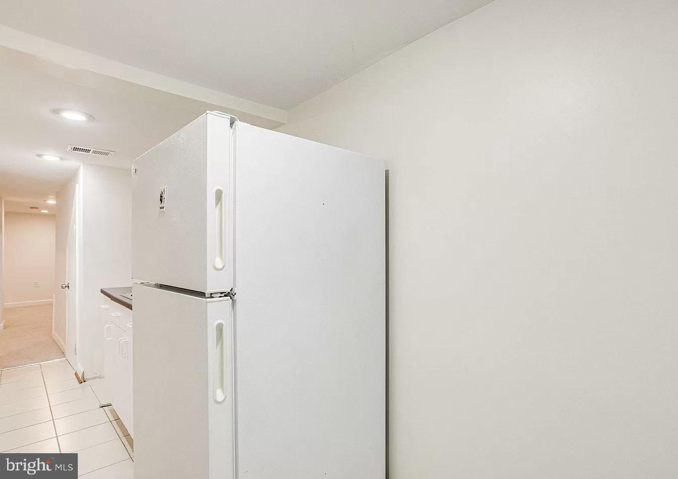 595 Columbia Road Northwest Washington, DC 20001 - Photo 34 of 36 a bathroom with a shower and a glass door