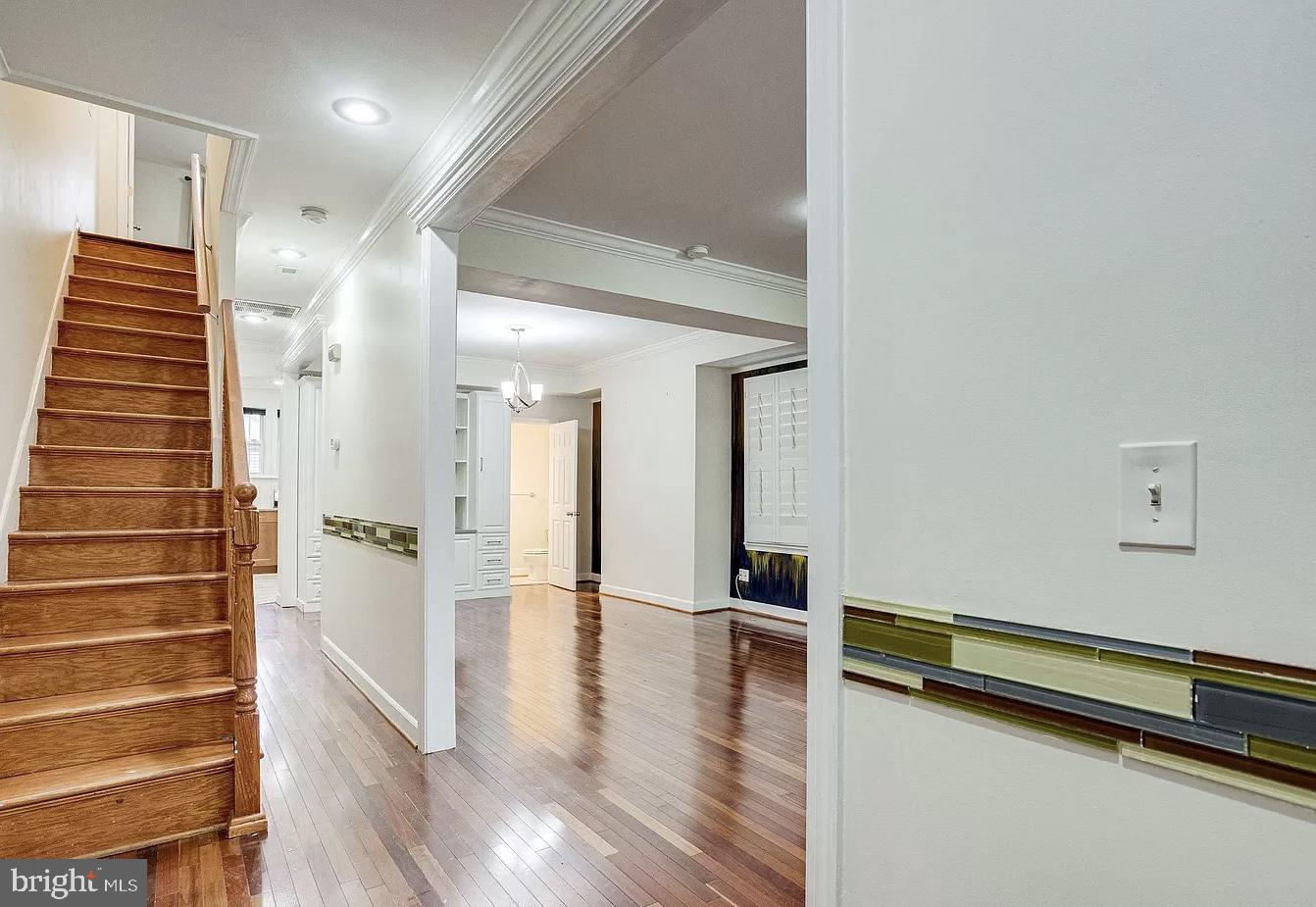 595 Columbia Road Northwest Washington, DC 20001 - Photo 4 of 36 a view of a hallway with stairs