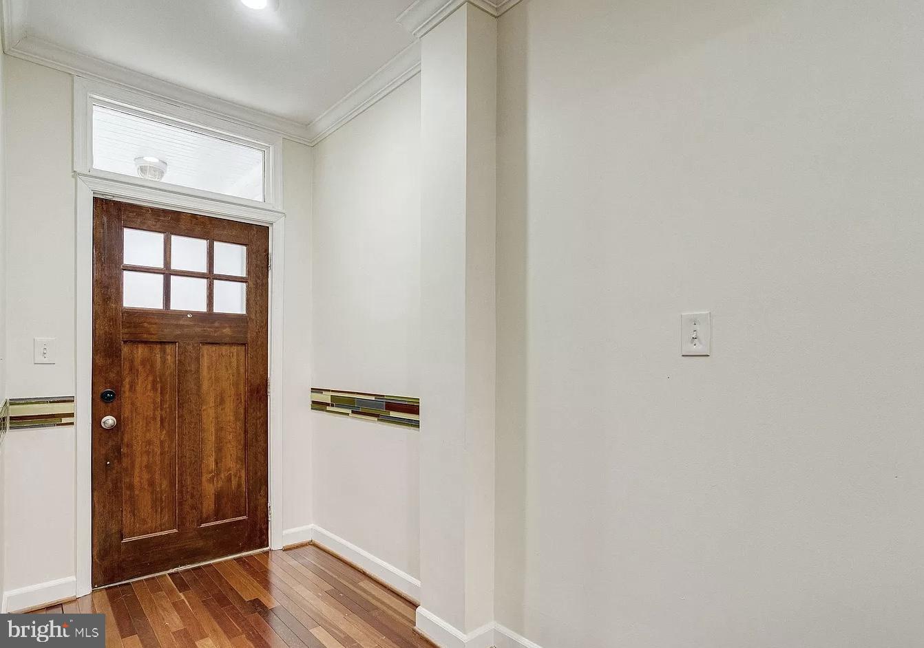 595 Columbia Road Northwest Washington, DC 20001 - Photo 5 of 36 wooden floor in an empty room