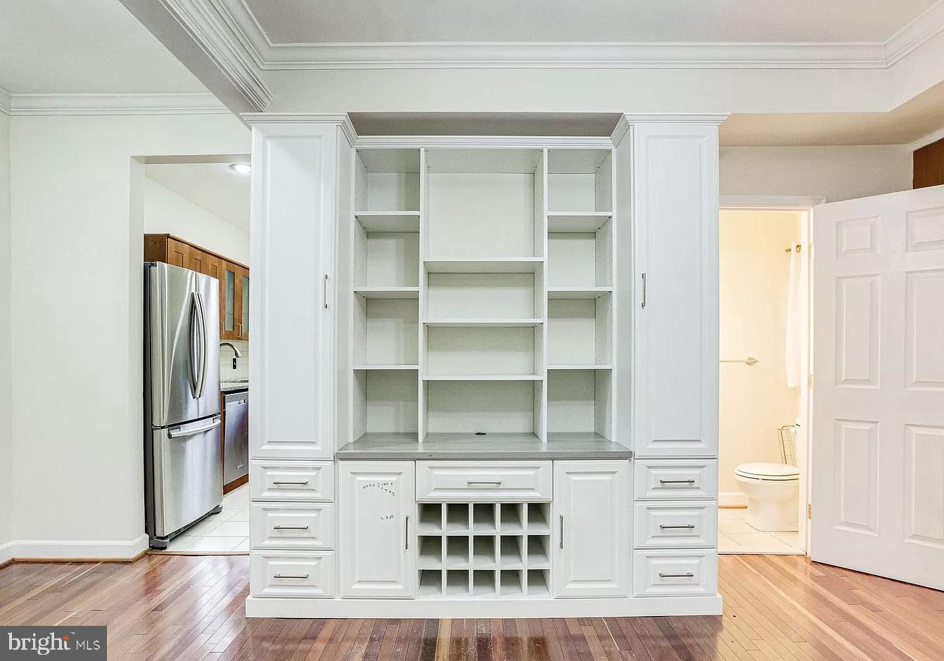 595 Columbia Road Northwest Washington, DC 20001 - Photo 8 of 36 a view of walk in closet with empty racks