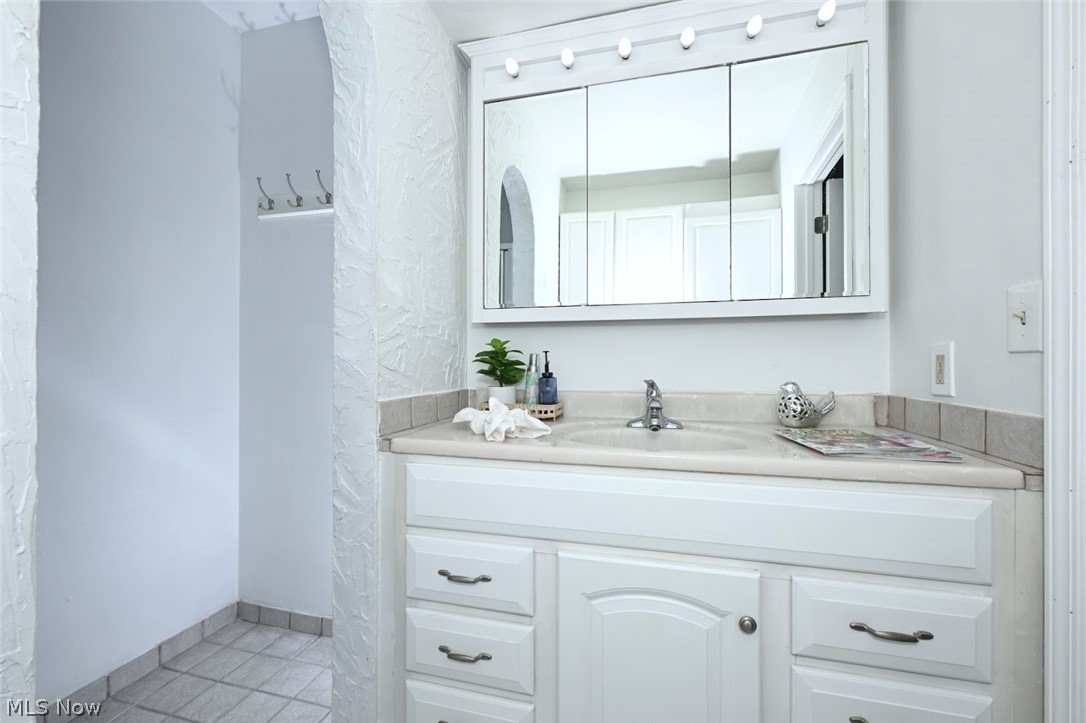 6151 Taylor Road Clinton, OH 44216 - Photo 21 of 49 *FIRST FLOOR FULL BATHROOM W/VANITY, TILED FLOORING AND WALK IN SHOWER ~