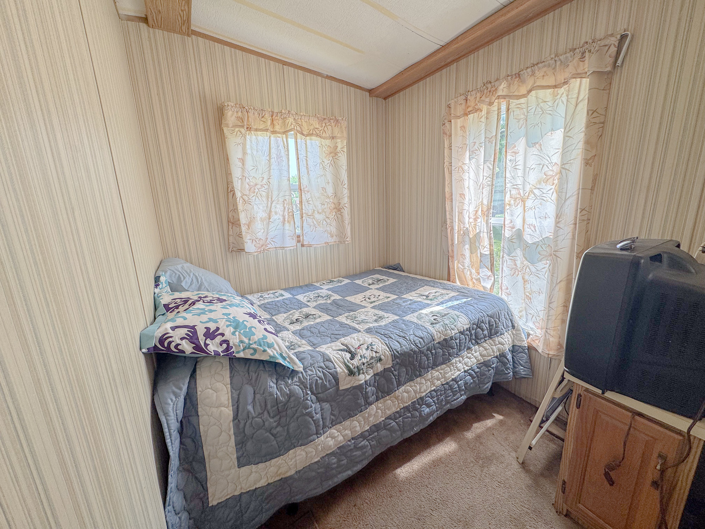 11-221 Woodhaven Sublette, IL 61367 - Photo 16 of 22 a bedroom with a bed and a window