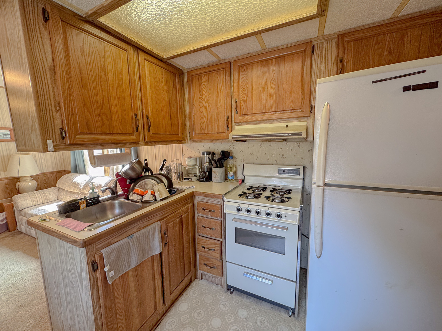 11-221 Woodhaven Sublette, IL 61367 - Photo 19 of 22 a kitchen with a stove and a refrigerator