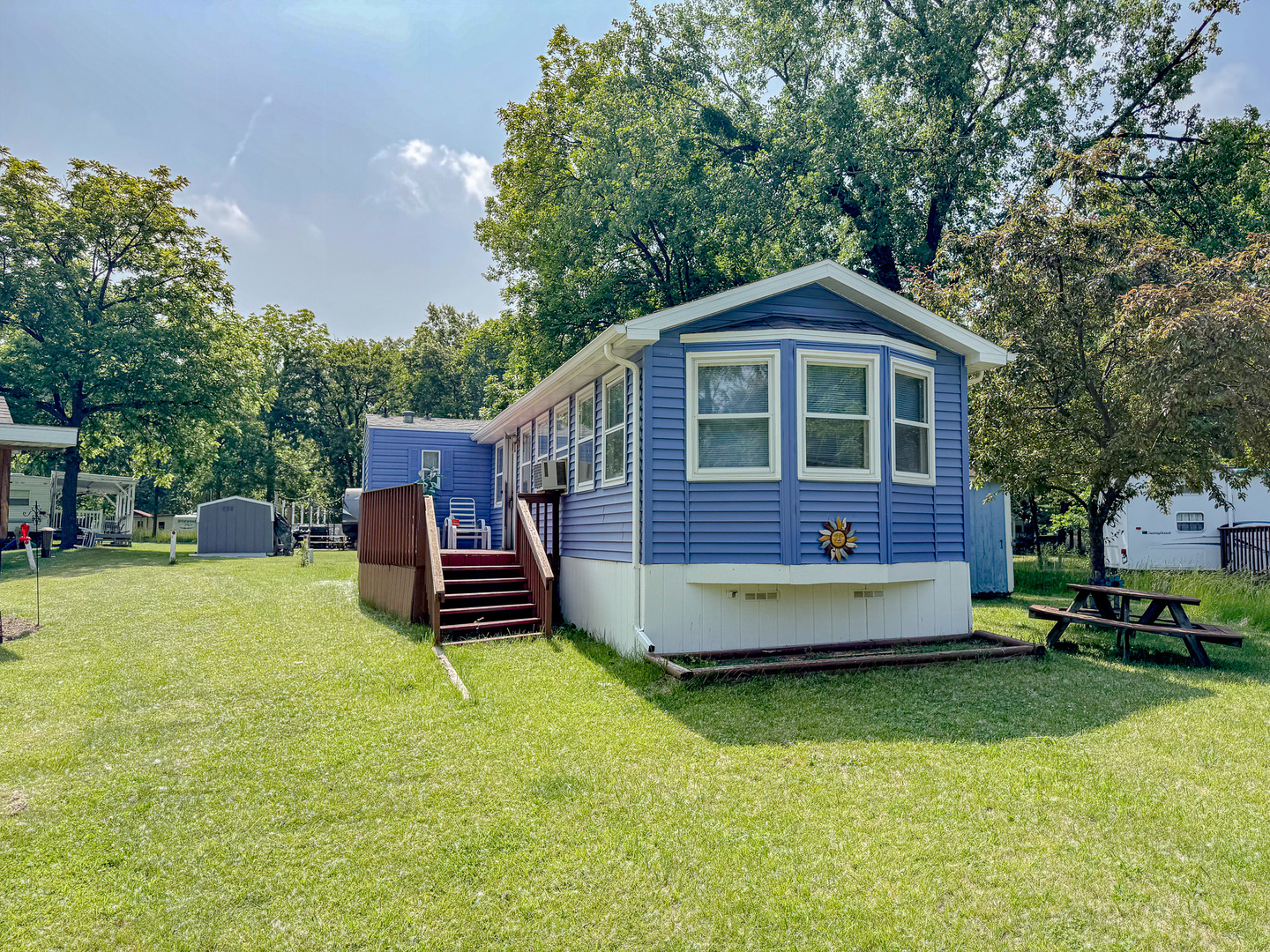 11-221 Woodhaven Sublette, IL 61367 - Photo 2 of 22 a front view of a house with a yard