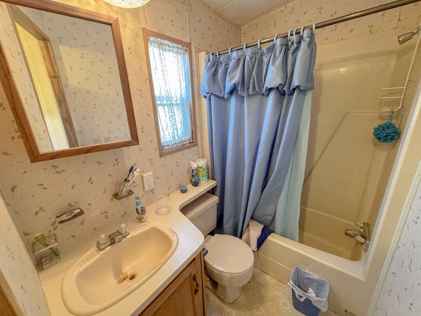 11-221 Woodhaven Sublette, IL 61367 - Photo 22 of 22 a bathroom with a sink toilet and shower