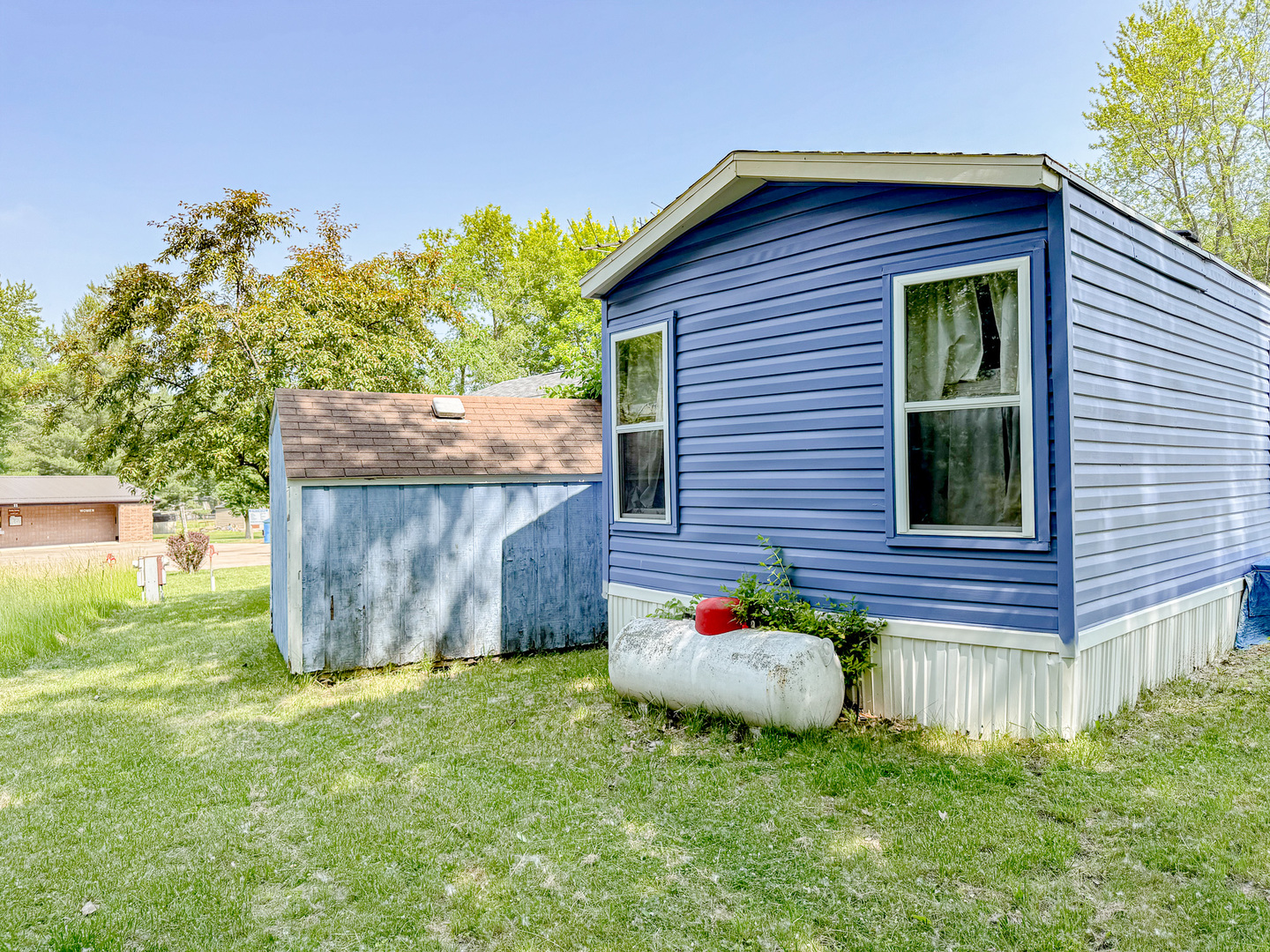 11-221 Woodhaven Sublette, IL 61367 - Photo 5 of 22 a front view of a house with a garden