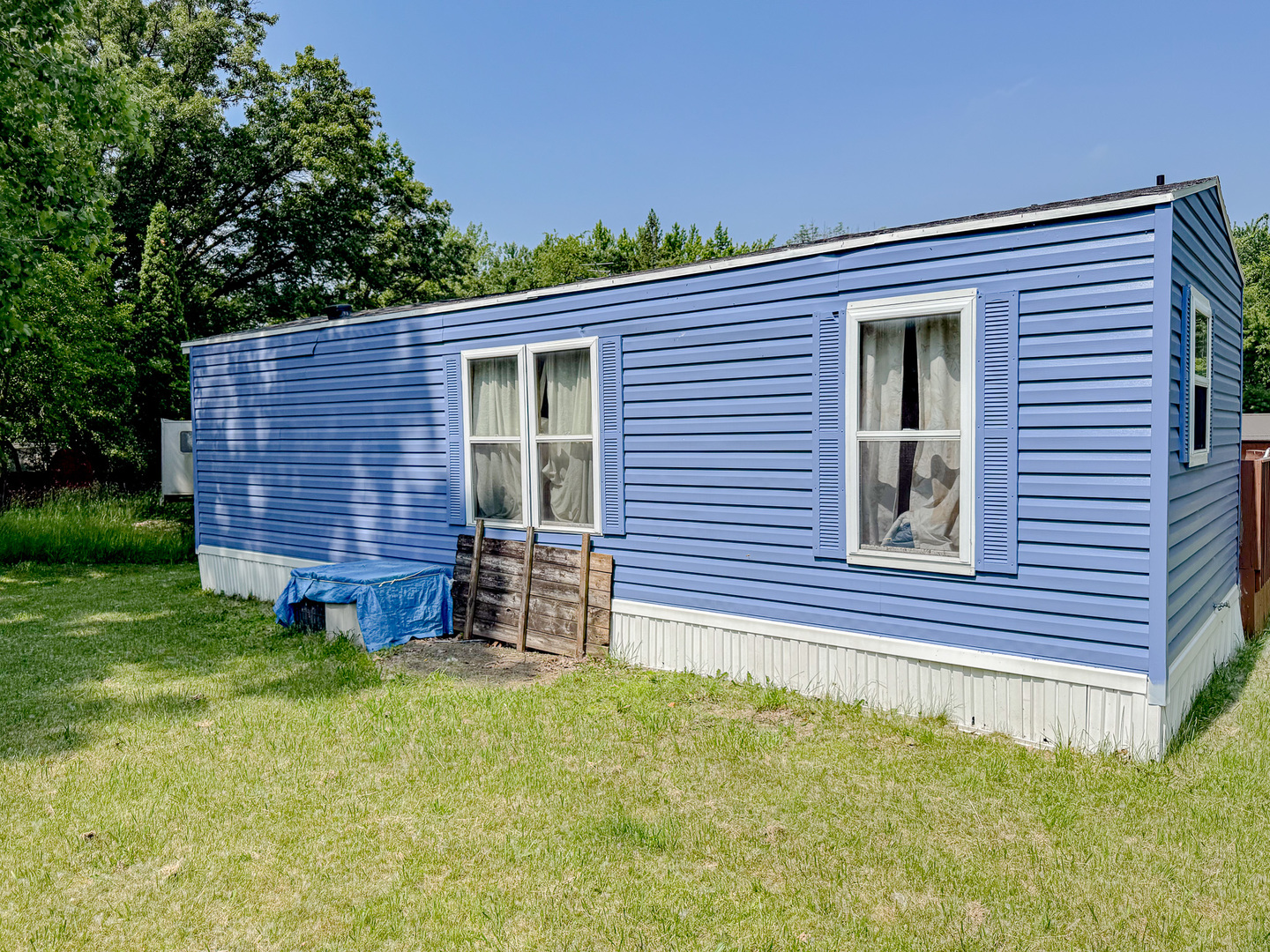 11-221 Woodhaven Sublette, IL 61367 - Photo 6 of 22 a front view of a house with a garden