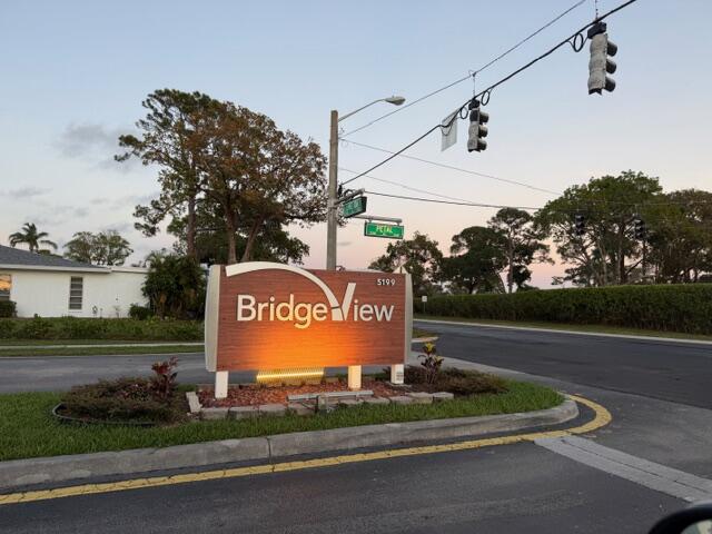 5140 Poppy Place, Unit B Delray Beach, FL 33484 - Photo 14 of 14 a sign on the side of the road