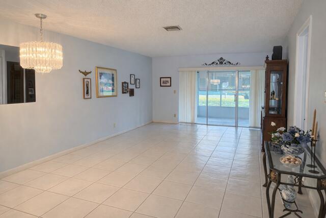 5140 Poppy Place, Unit B Delray Beach, FL 33484 - Photo 3 of 14 a view of an empty room and window