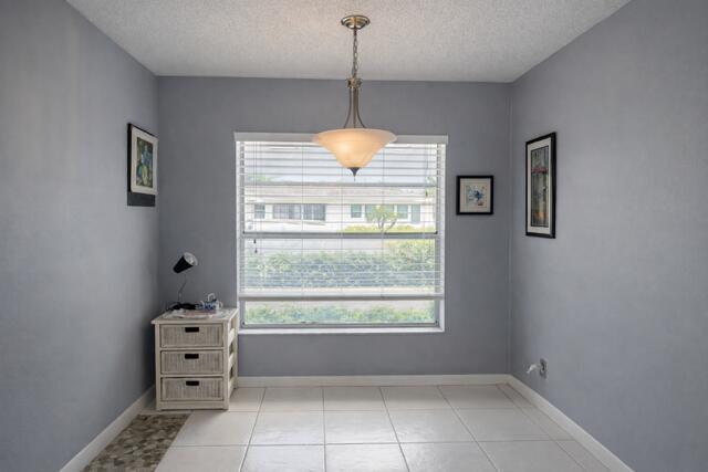 5140 Poppy Place, Unit B Delray Beach, FL 33484 - Photo 4 of 14 a room with window and walk in closet with window