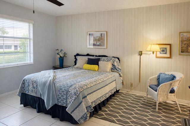 5140 Poppy Place, Unit B Delray Beach, FL 33484 - Photo 5 of 14 a bedroom with a bed and window