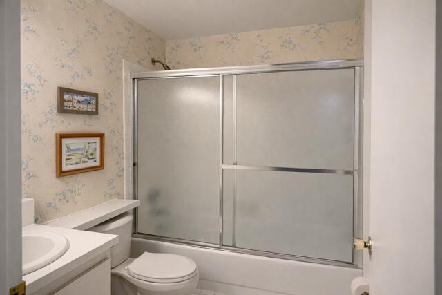 5140 Poppy Place, Unit B Delray Beach, FL 33484 - Photo 6 of 14 a bathroom with a shower and a toilet