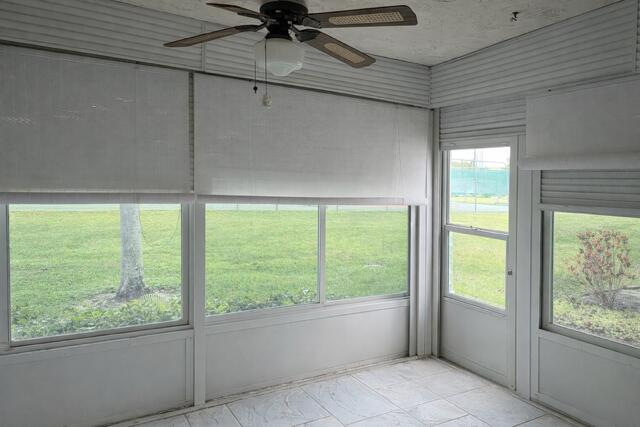 5140 Poppy Place, Unit B Delray Beach, FL 33484 - Photo 9 of 14 a view of an empty room with a window