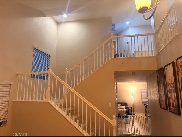 a view of a living room and a balcony
