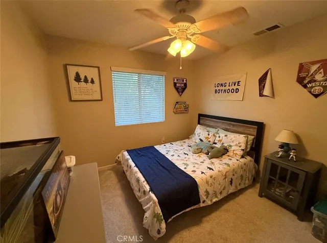 a bedroom with a bed and cabinets
